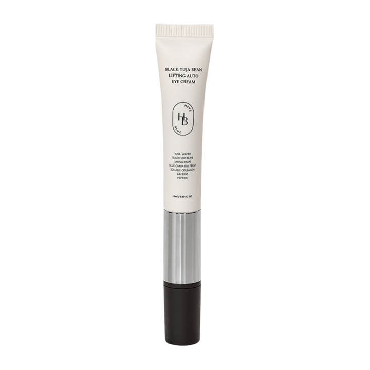 Produktbild av HEVE BLUE Black Yuja Bean Lifting Auto Eye Cream – en tub med vit ovandel, silvermitt och svart applikator. Text på förpackningen listar ingredienser som yuja water och black soy bean.