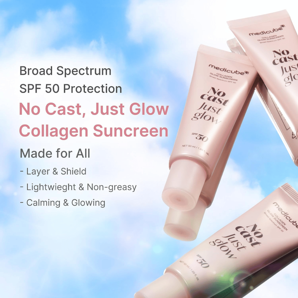 Medicube Collagen Glow Sunscreen SPF 50, lätt solskydd med glow-effekt utan vit hinna. Rosa solskyddstuber mot en blå himmel.