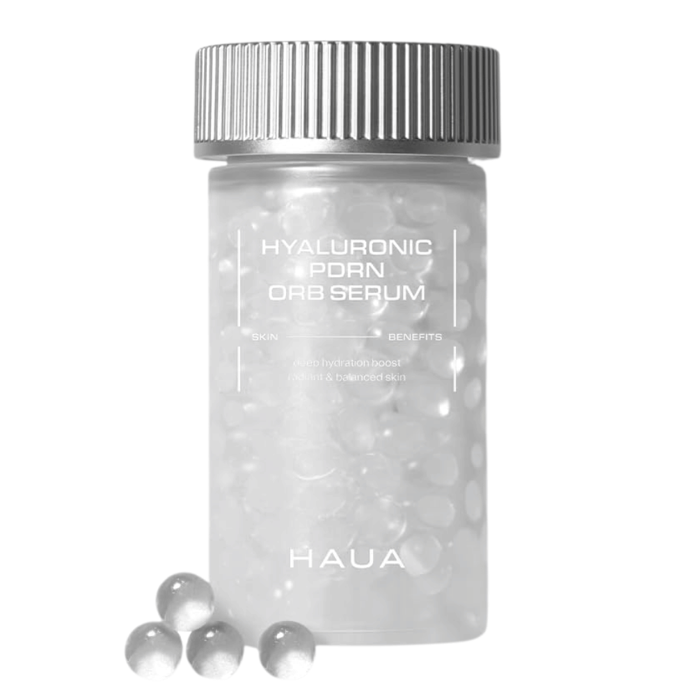 Produktbild av HAUA Hyaluronic PDRN Orb Serum på vit bakgrund. Den transparenta behållaren är fylld med serumkulor och framhäver produktens unika inkapslade formulering.