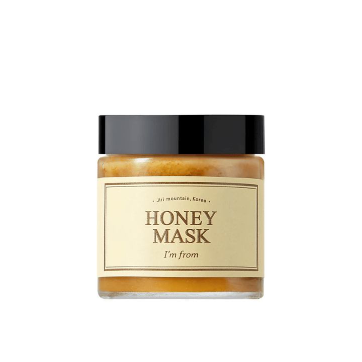  En burk "I'm from Honey Mask", med naturligt honungsinnehåll, mot vit bakgrund.