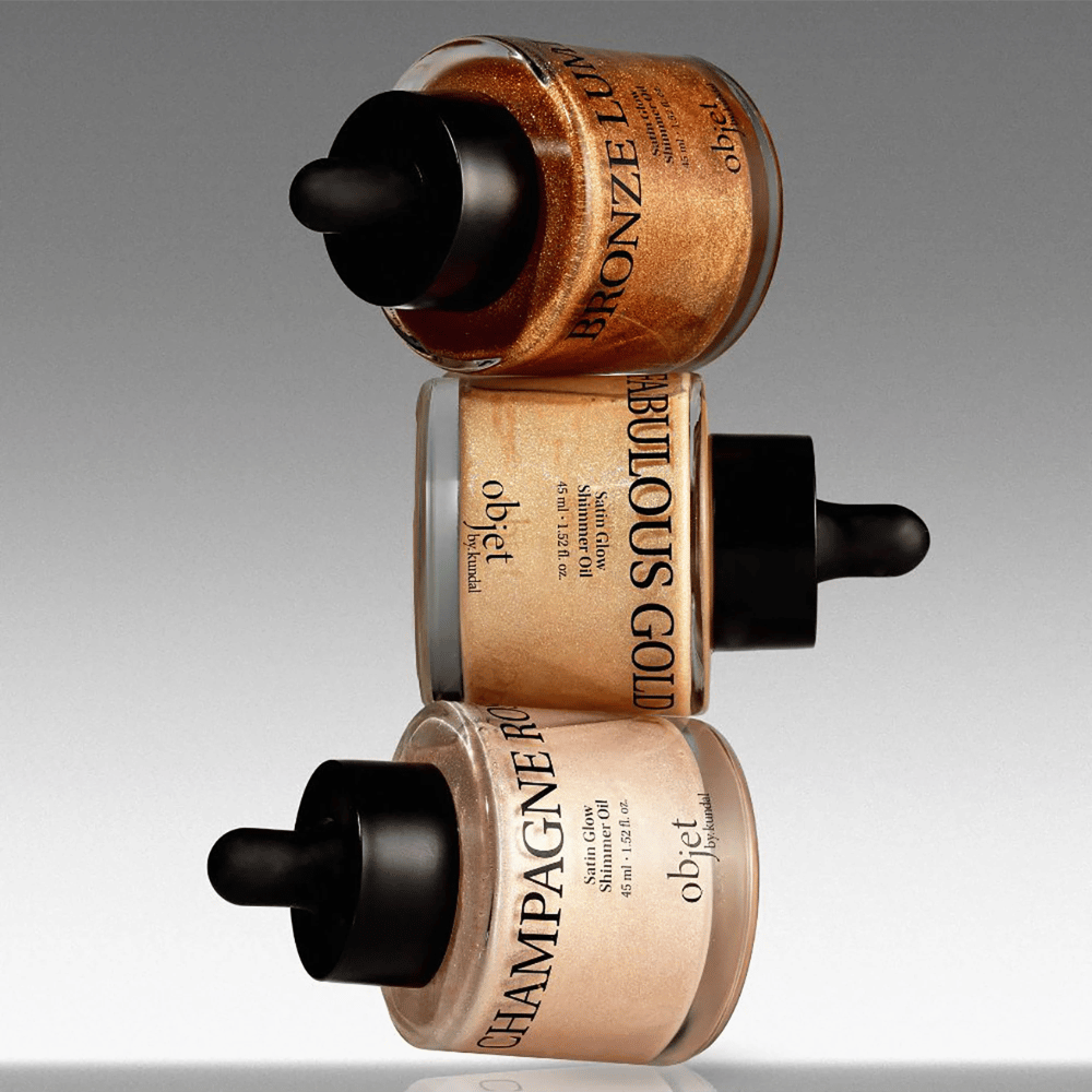 Objet by KUNDAL Satin Glow Shimmer Oil i Bronze Lumière, Fabulous Gold och Champagne Rose – skimrande kroppsoljor med lystergivande finish.