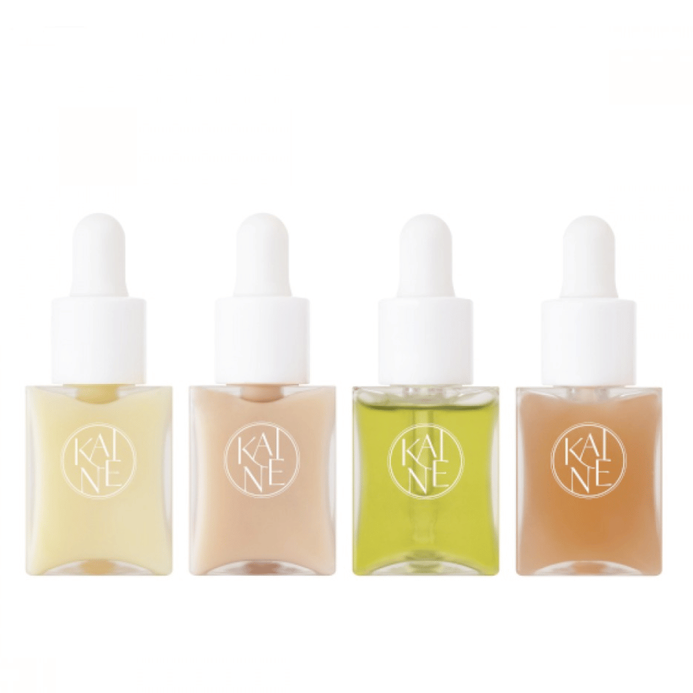 Fyra färgglada serumflaskor från KAINÉ Serum Discovery Kit med pipettkork, designade för att möta olika hudbehov i en minimalistisk och stilren förpackning.