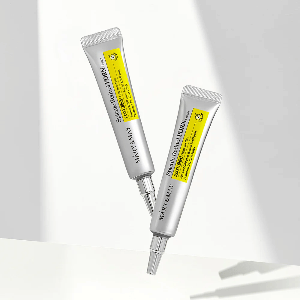 Två tuber av MARY & MAY Spicule Retinol PDRN Cream på ljus bakgrund, en intensiv nattkräm med spicule och retinol för hudförnyelse och förbättrad hudtextur.