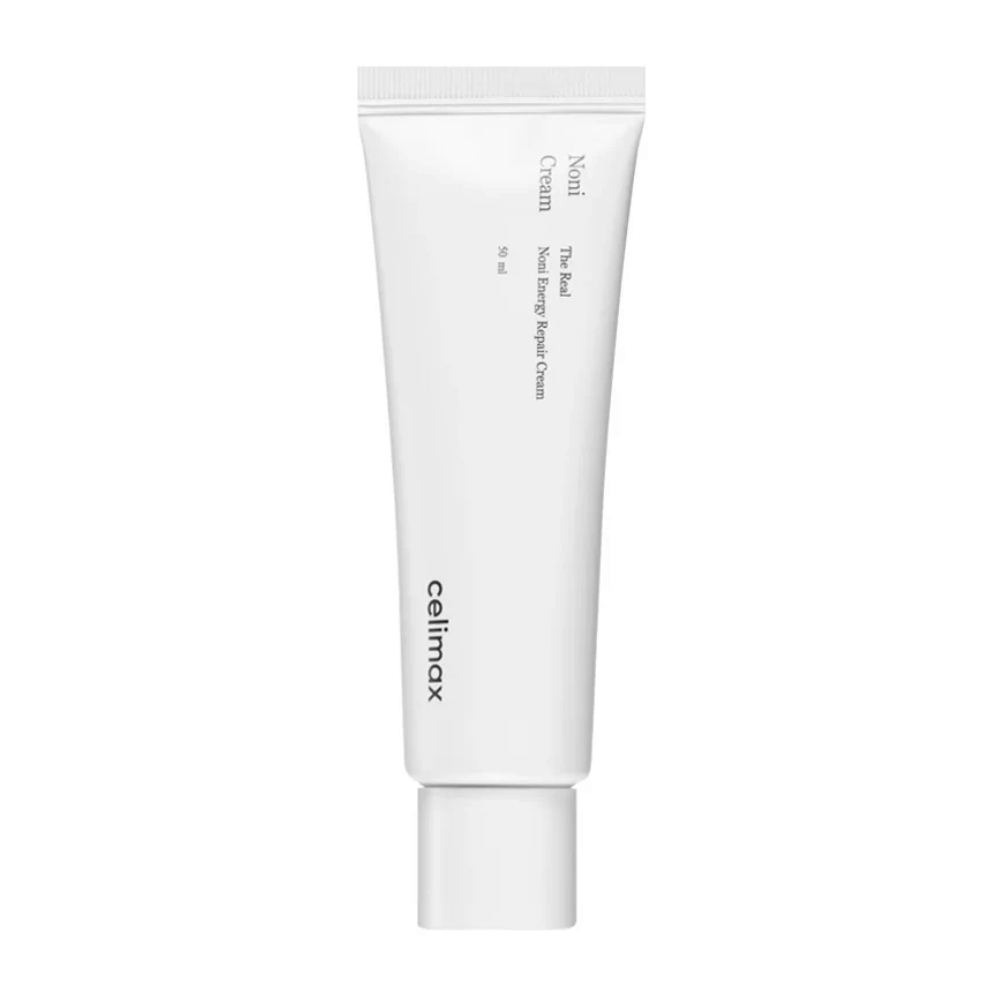 Celimax Noni Energy Repair Cream i en vit tub med svart text. Produkten är märkt som "The Real Noni Energy Repair Cream" och har en volym på 50 ml.
