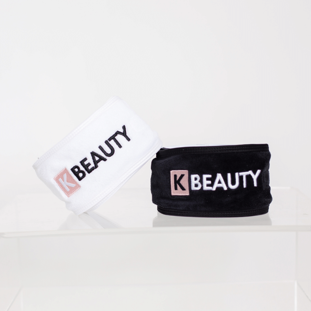 Två K-Beauty Makeup Pannband med ordet "skönhet" på.
